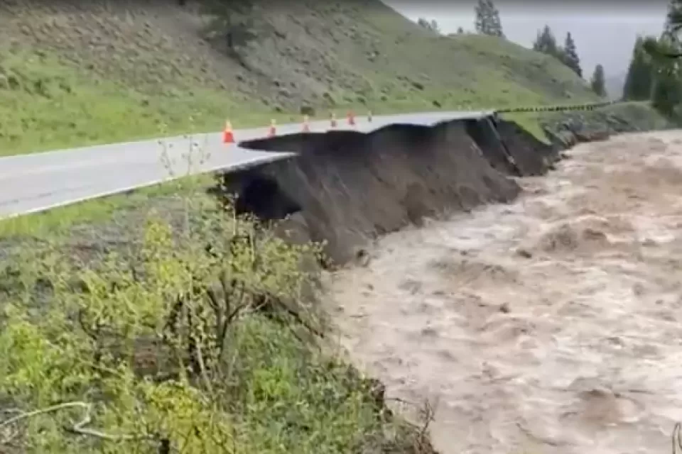 Floodwaters and damaged road in Yellowstone National Park